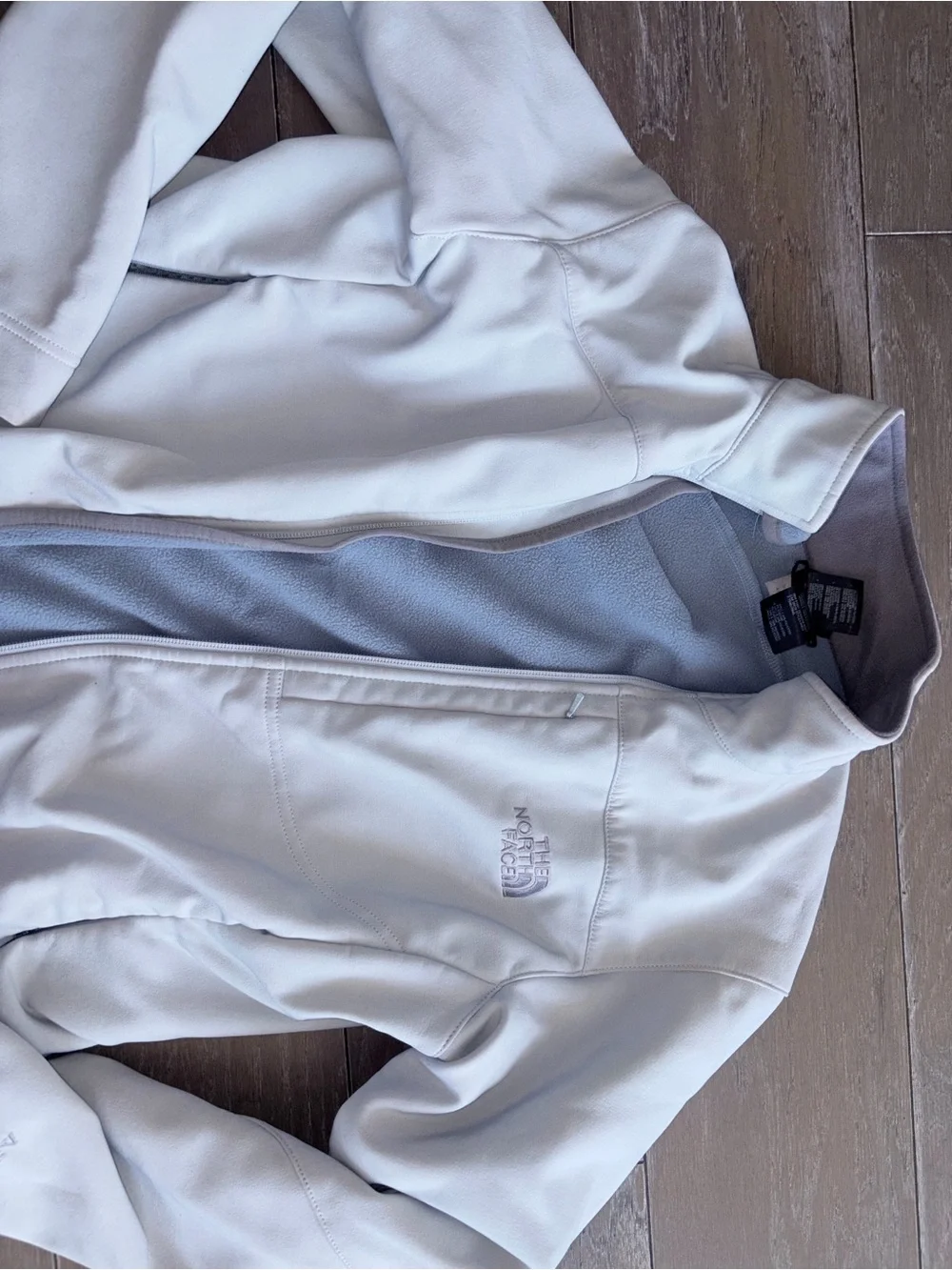 The North Face Women's White Softshell Jacket with Light Gray Fleece Lining